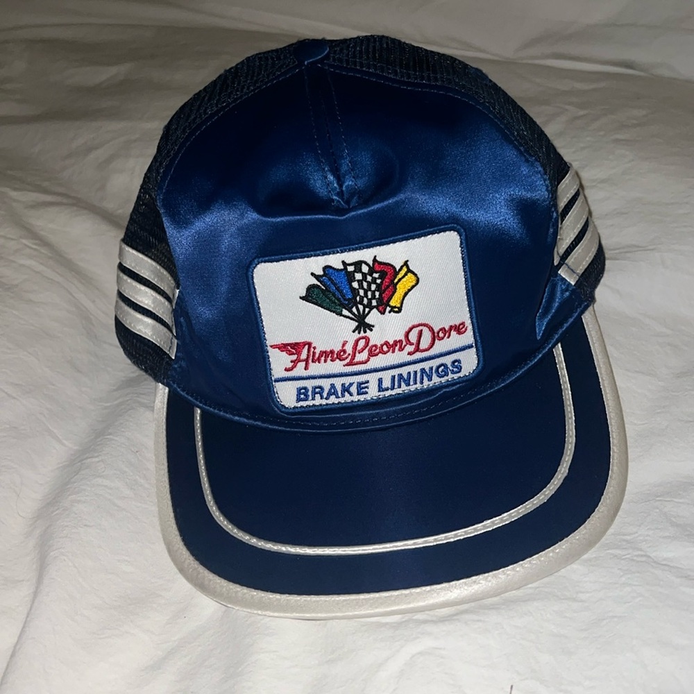 Aime Leon Dore brake linings satin trucker hat in royal blue and white.